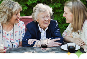 Three women discussing Axona patient instructions