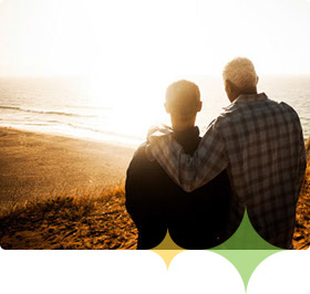 Alzheimer's patient and adult son relax by water